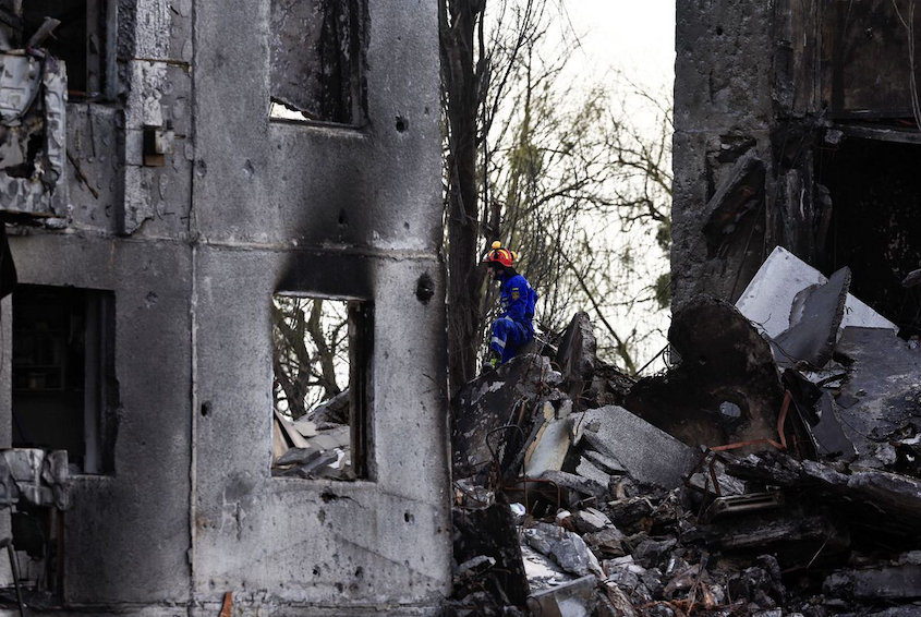 rescuer searching rubble